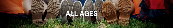 ID: Five pairs of Shoes soles on grass with bold White text "all ages"