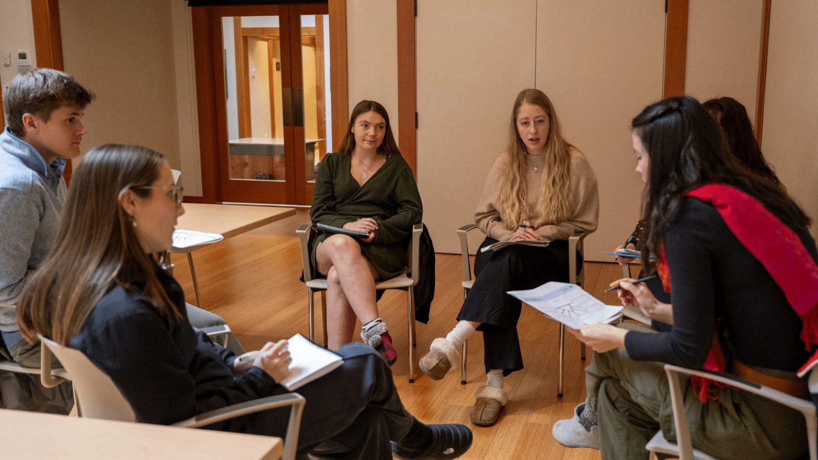 Young Leaders connecting during a small group discussion at the Summit. Photo by Mike Crane Photography